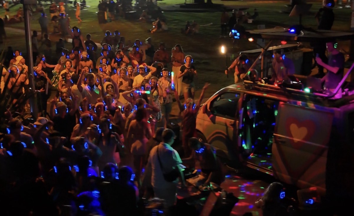 DJs on the roof of the van playing to the headphone crowd